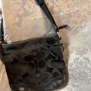 Coach monogram black fabric hand back with leather and silver accents